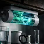 A glowing UV purifier with flowing water, a glass, filters, and a testing vial.